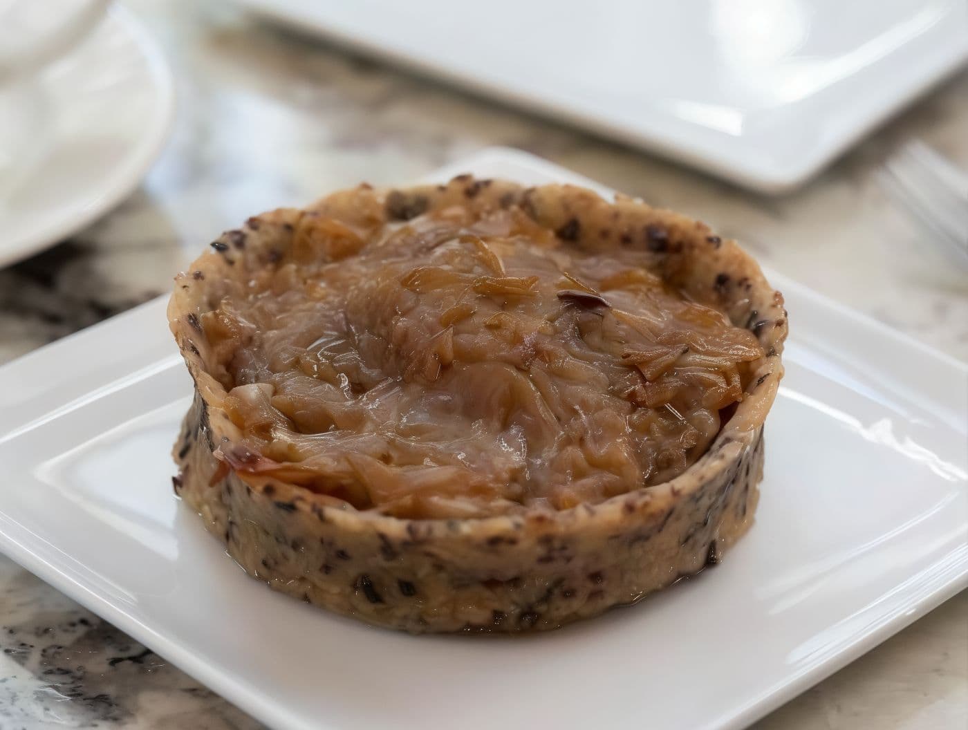 Imagen de Tarta de cebolla caramelizada y queso de cabra sin harina de trigo